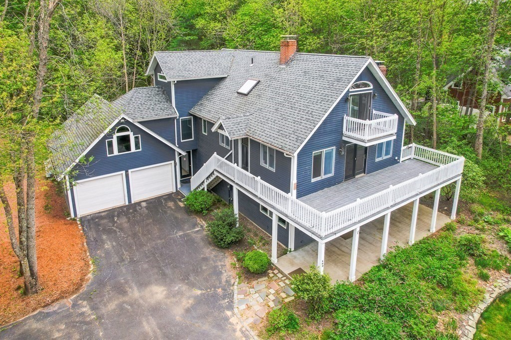 149 Pleasant Valley Road Amesbury, MA 01913 - Photo 2 of 42 a aerial view of a house next to a yard