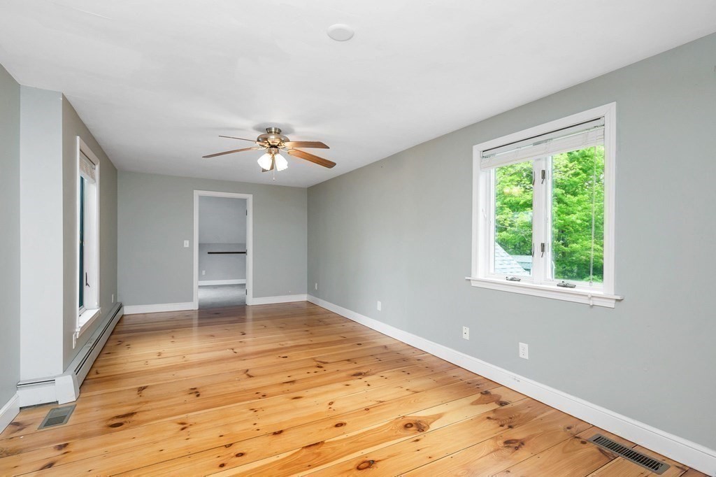 149 Pleasant Valley Road Amesbury, MA 01913 - Photo 29 of 42 wooden floor in an empty room with a window