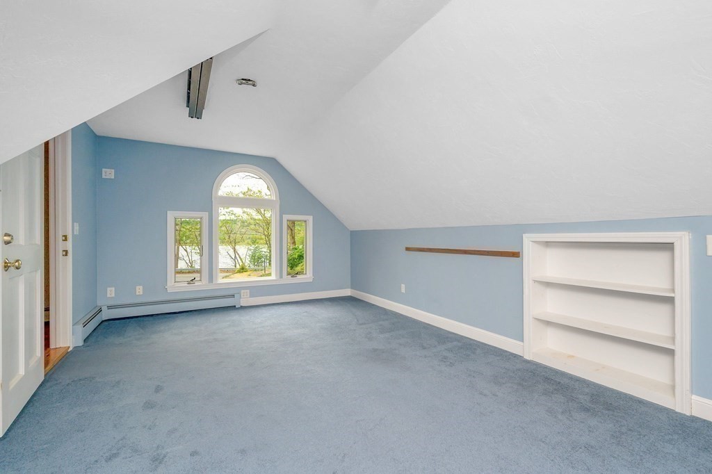 149 Pleasant Valley Road Amesbury, MA 01913 - Photo 31 of 42 an empty room with a empty space and windows