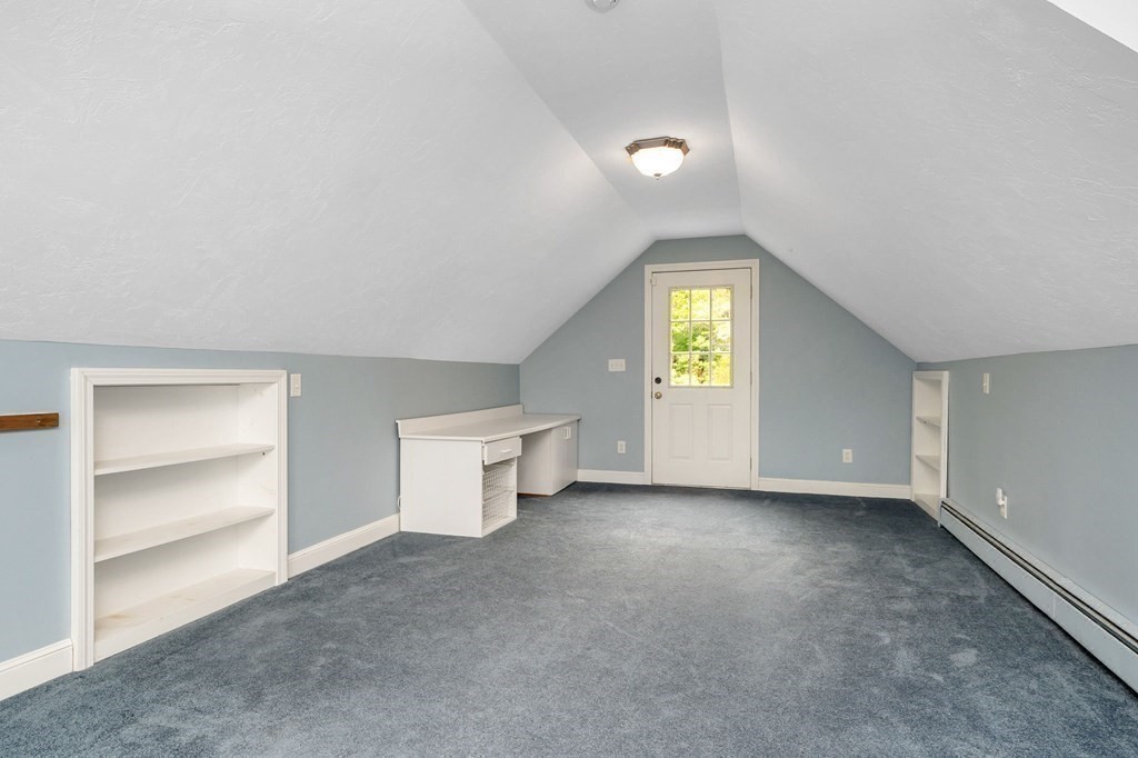 149 Pleasant Valley Road Amesbury, MA 01913 - Photo 32 of 42 a view of an empty room with a window and kitchen