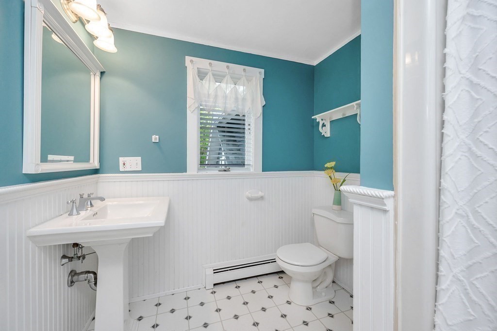 149 Pleasant Valley Road Amesbury, MA 01913 - Photo 35 of 42 a bathroom with a sink toilet and a mirror
