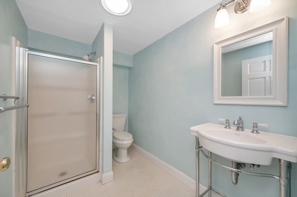 149 Pleasant Valley Road Amesbury, MA 01913 - Photo 36 of 42 a bathroom with a sink a toilet and shower