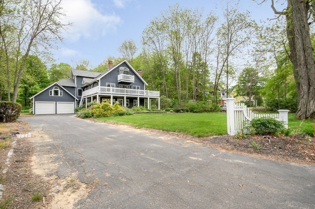 149 Pleasant Valley Road Amesbury, MA 01913 - Photo 38 of 42 a front view of house with yard and green space