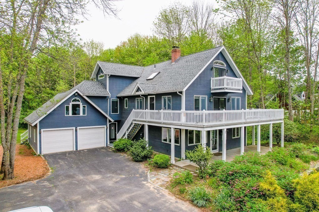 149 Pleasant Valley Road Amesbury, MA 01913 - Photo 42 of 42 a front view of a house with a yard and trees