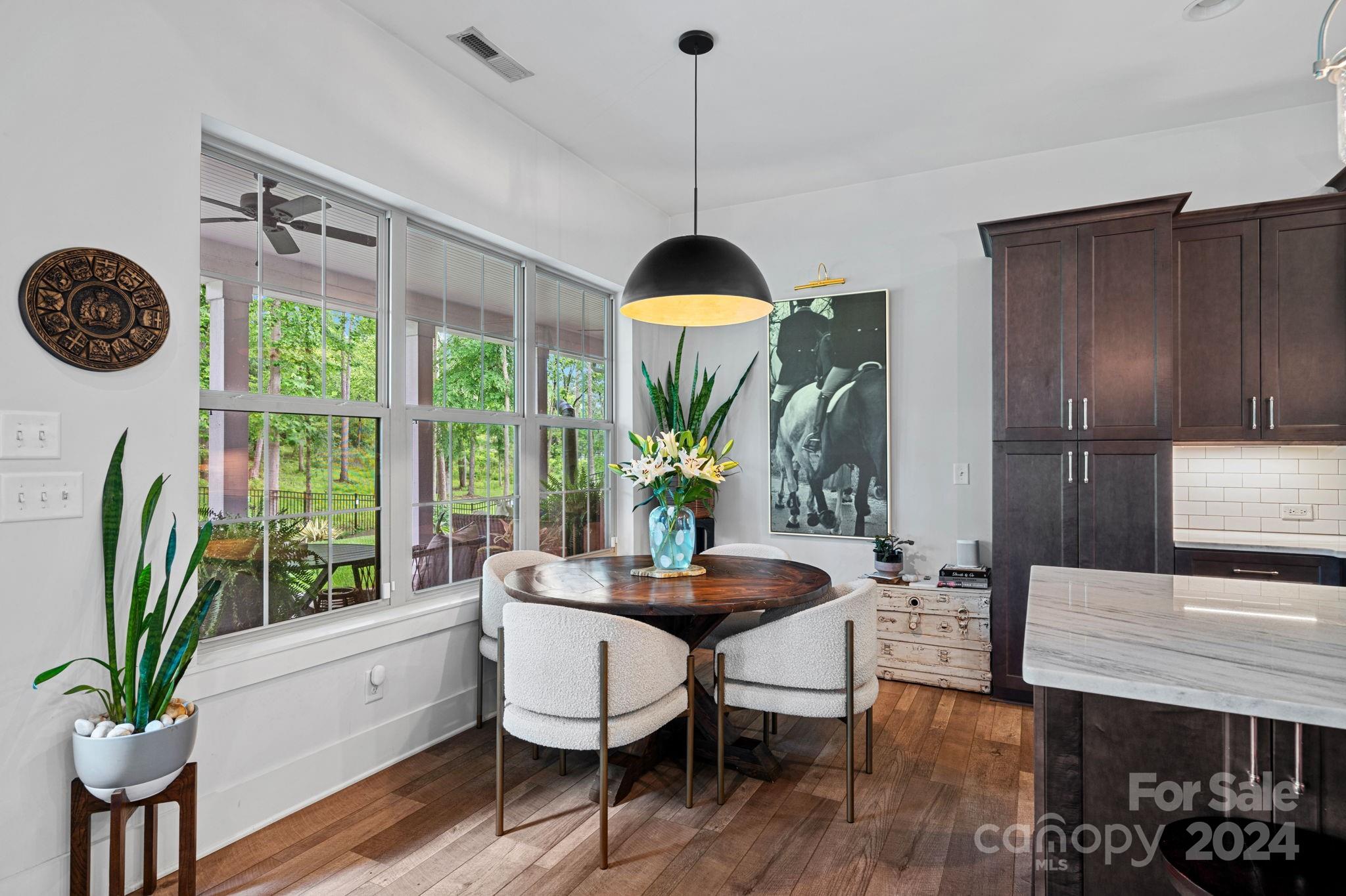 203 Webbed Foot Road Mooresville, NC 28117 - Photo 13 of 34 a living room with furniture a window and a chandelier