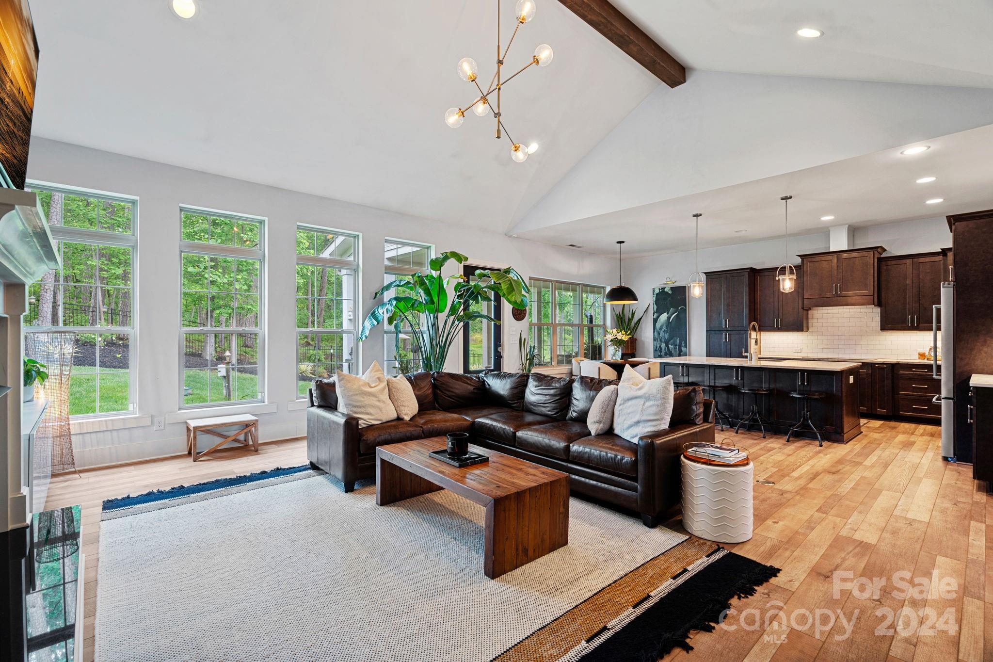 203 Webbed Foot Road Mooresville, NC 28117 - Photo 15 of 34 a living room with furniture and a large window