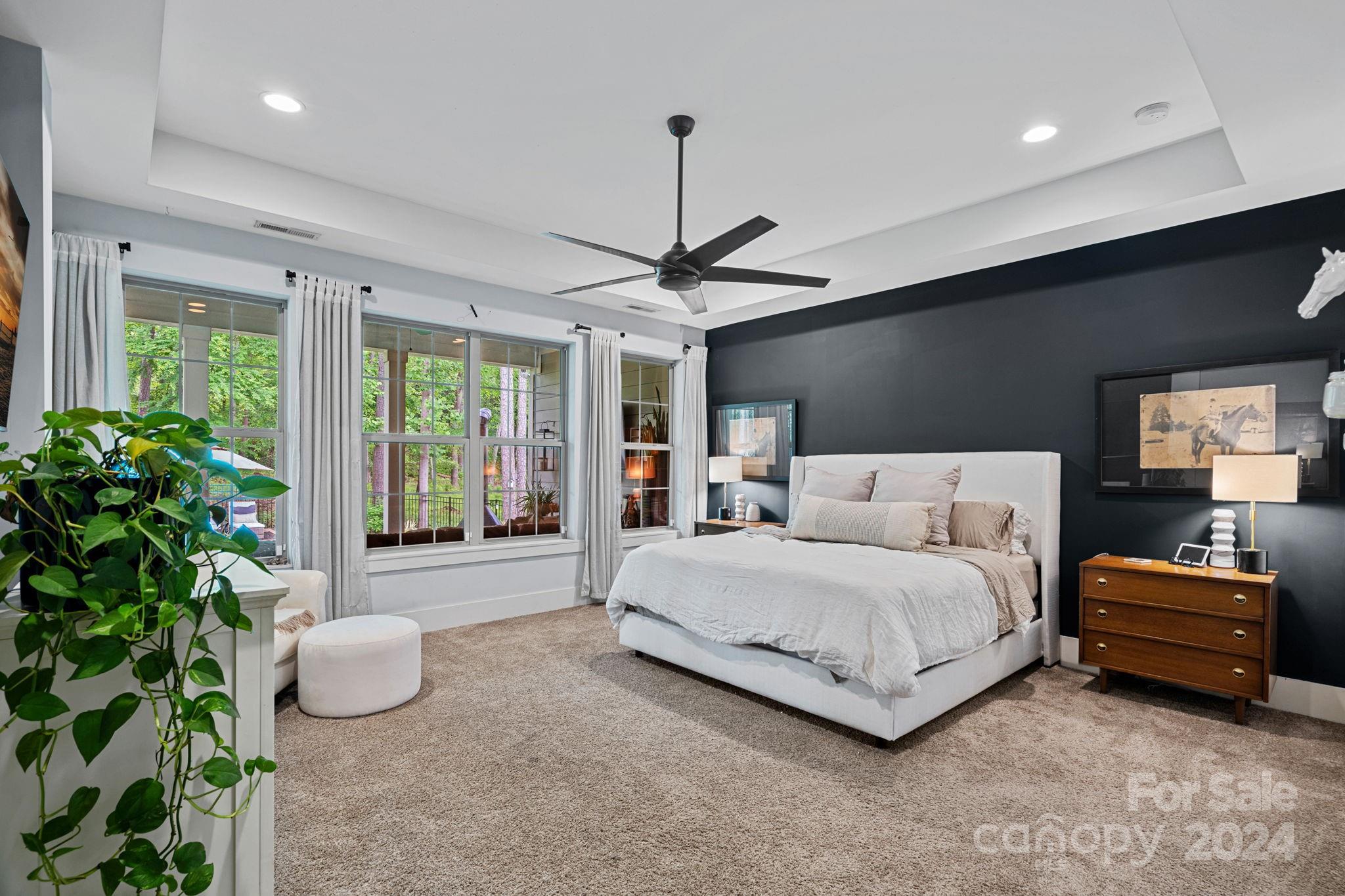 203 Webbed Foot Road Mooresville, NC 28117 - Photo 17 of 34 a spacious bedroom with a bed and a window
