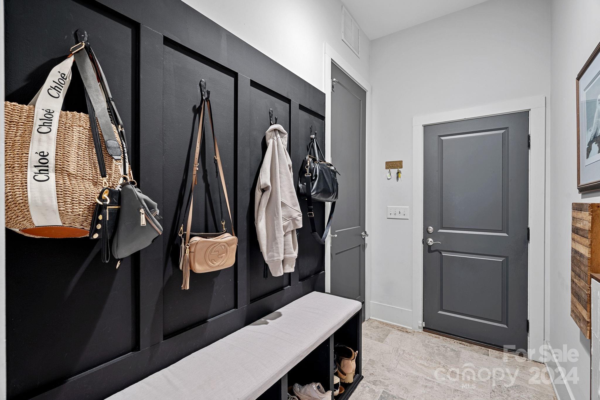 203 Webbed Foot Road Mooresville, NC 28117 - Photo 19 of 34 a room with lots of white furniture and wooden floor