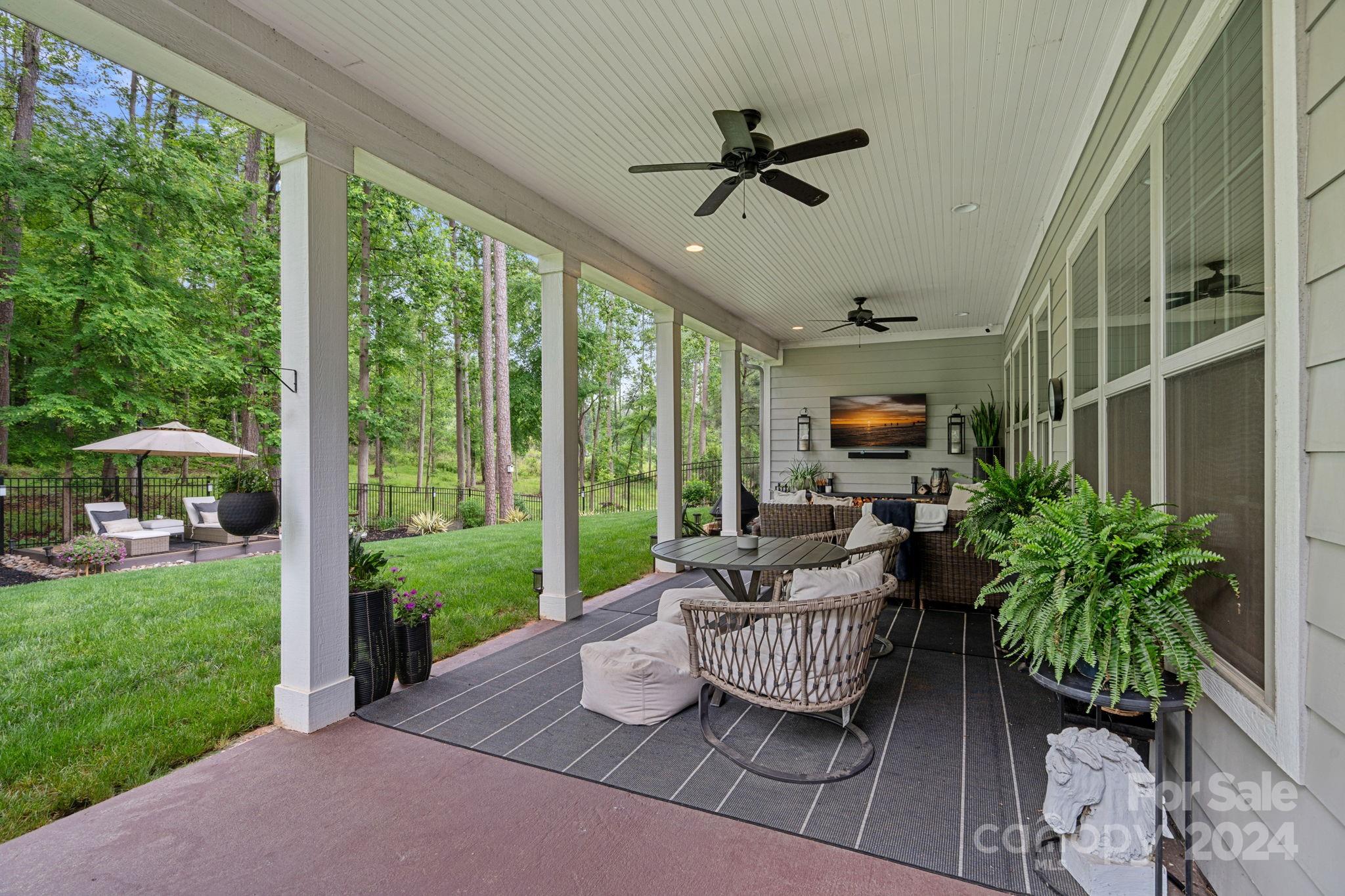 203 Webbed Foot Road Mooresville, NC 28117 - Photo 24 of 34 a living room with furniture and garden view