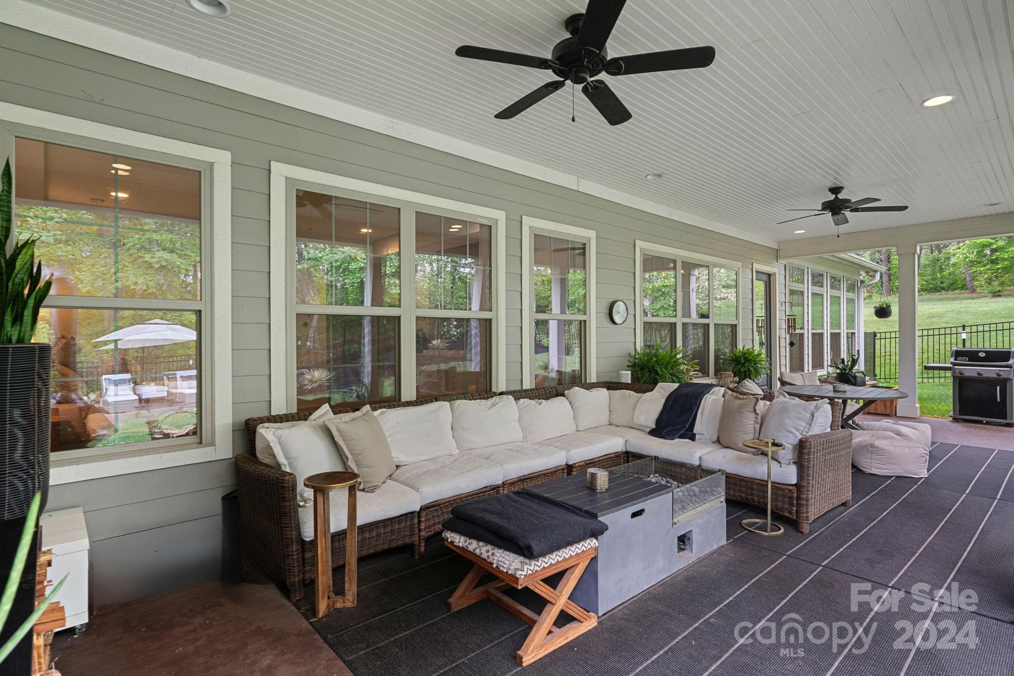 203 Webbed Foot Road Mooresville, NC 28117 - Photo 25 of 34 a living room with furniture and a large window