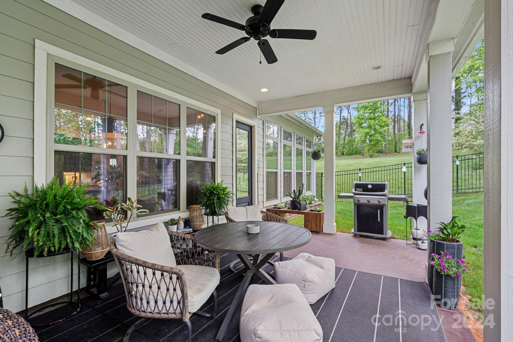 203 Webbed Foot Road Mooresville, NC 28117 - Photo 26 of 34 a outdoor space with patio the couches and a dining table with garden view