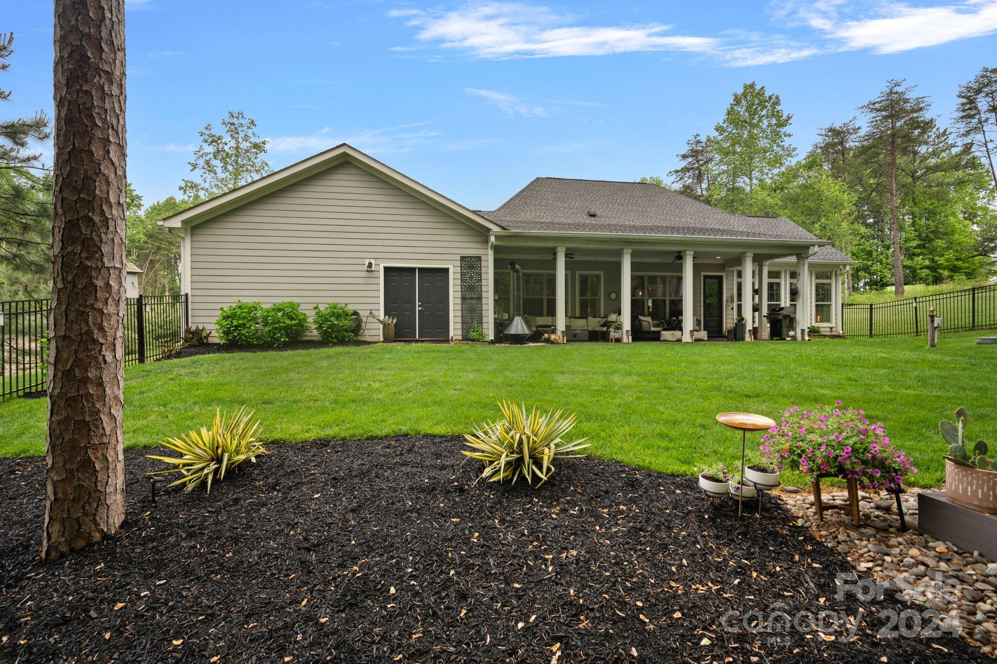 203 Webbed Foot Road Mooresville, NC 28117 - Photo 27 of 34 a view of a house with yard and a garden