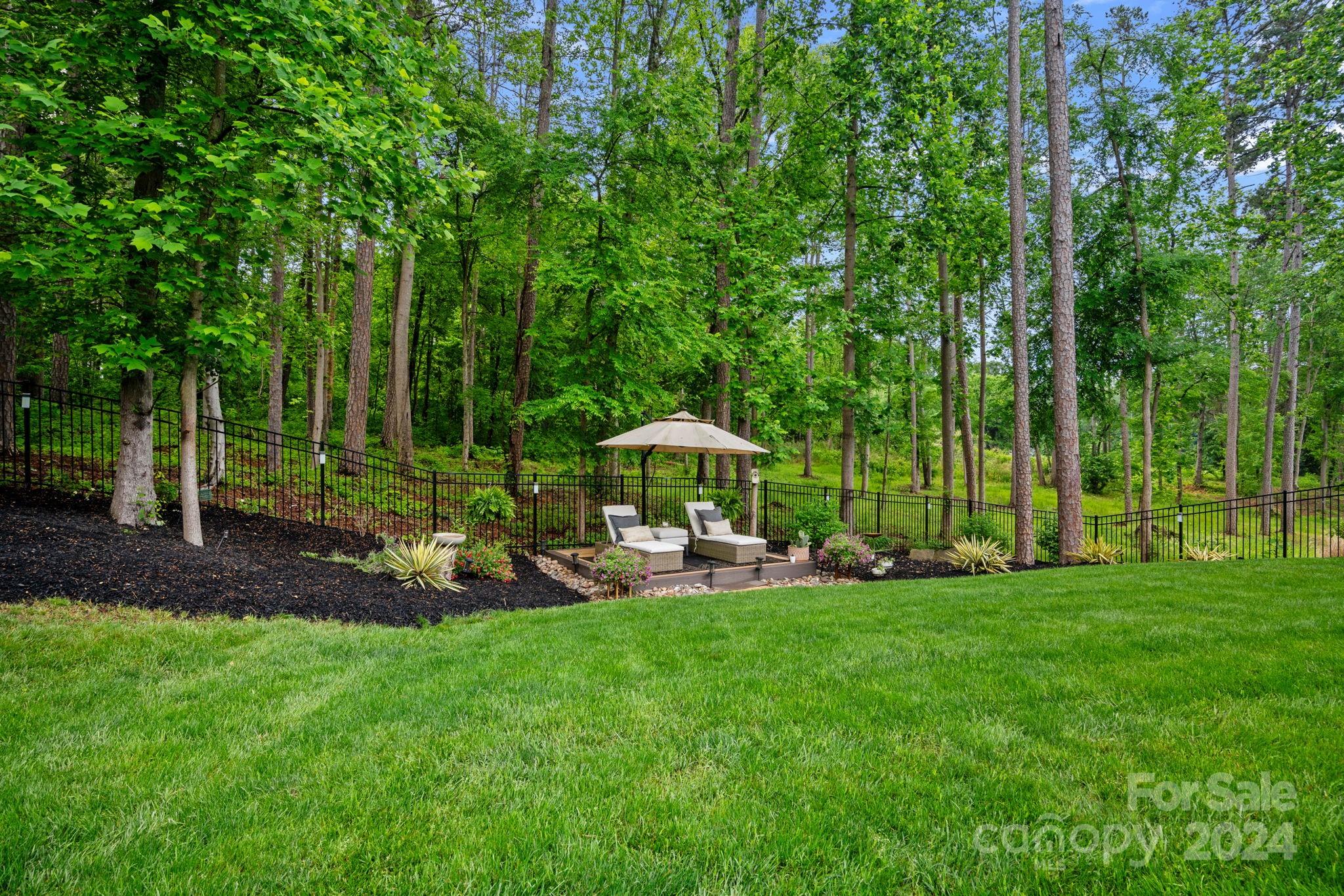 203 Webbed Foot Road Mooresville, NC 28117 - Photo 28 of 34 a view of a chair and table in the garden