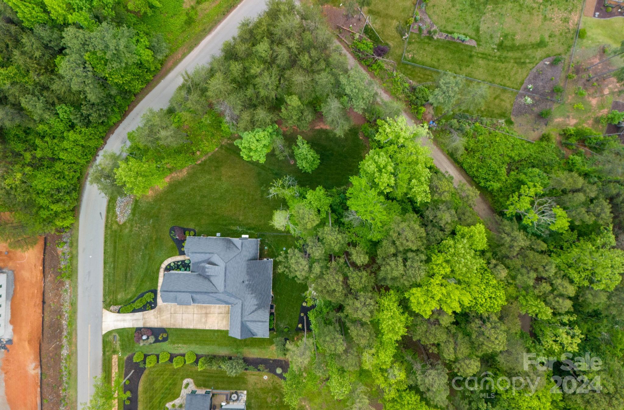 203 Webbed Foot Road Mooresville, NC 28117 - Photo 33 of 34 an aerial view of a house with a yard
