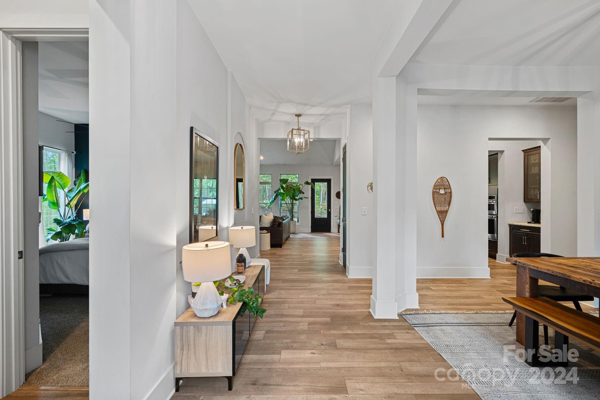 203 Webbed Foot Road Mooresville, NC 28117 - Photo 4 of 34 a living room with furniture and a potted plant