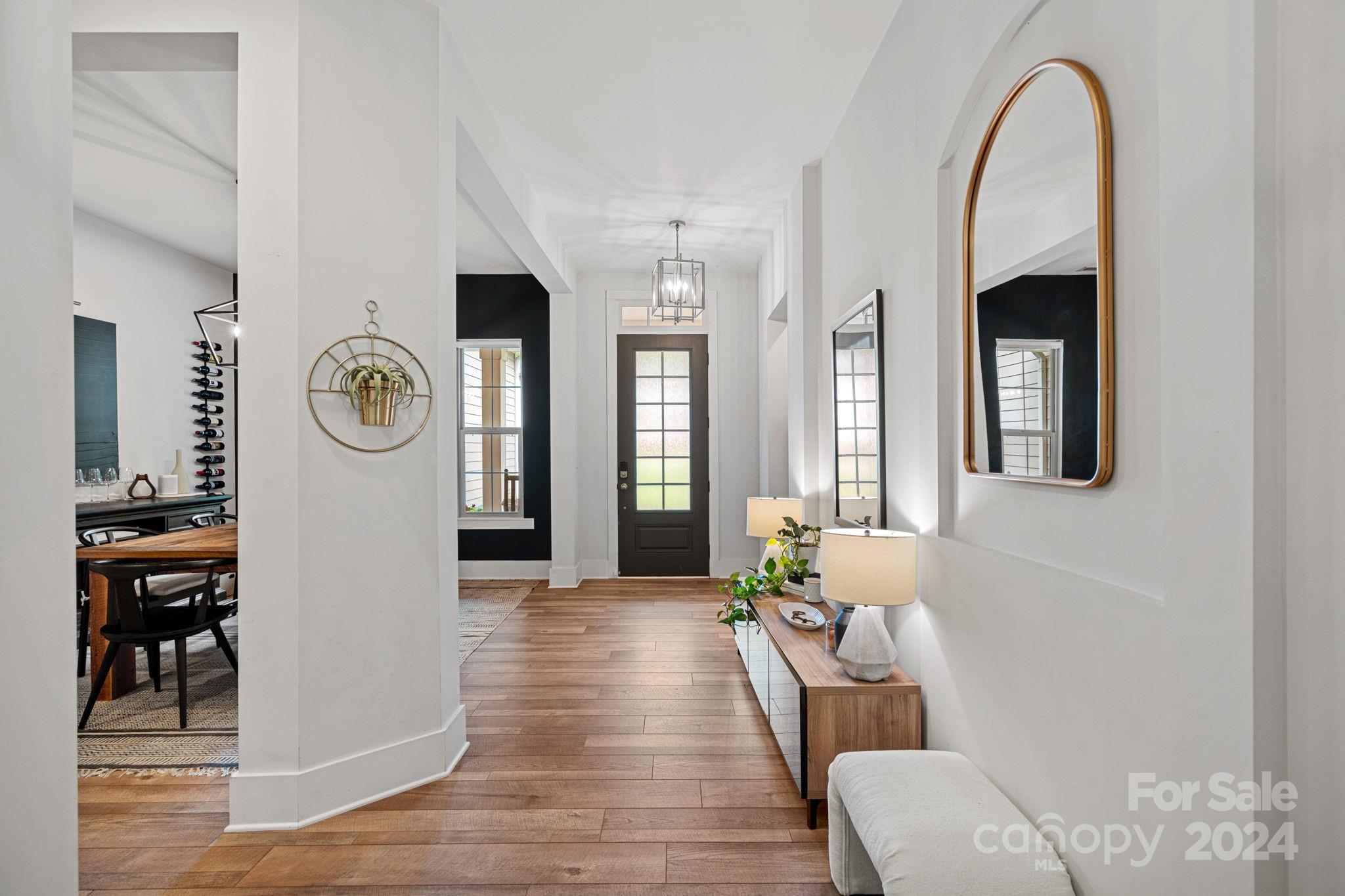 203 Webbed Foot Road Mooresville, NC 28117 - Photo 5 of 34 a living room with furniture and a fireplace