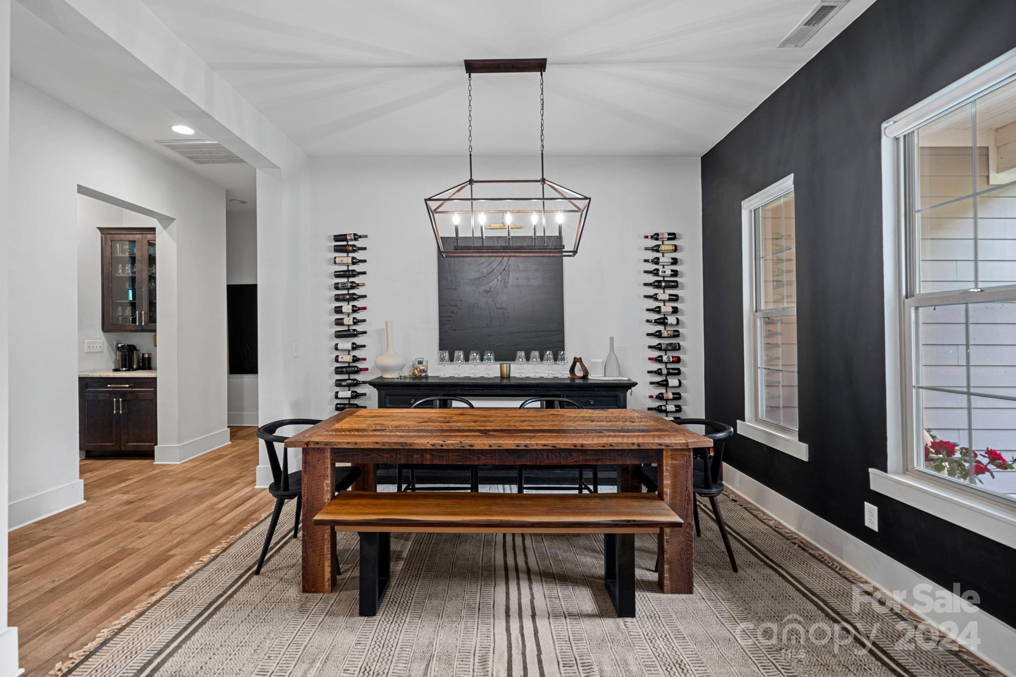 203 Webbed Foot Road Mooresville, NC 28117 - Photo 6 of 34 a view of a room with a table chairs and wooden floor