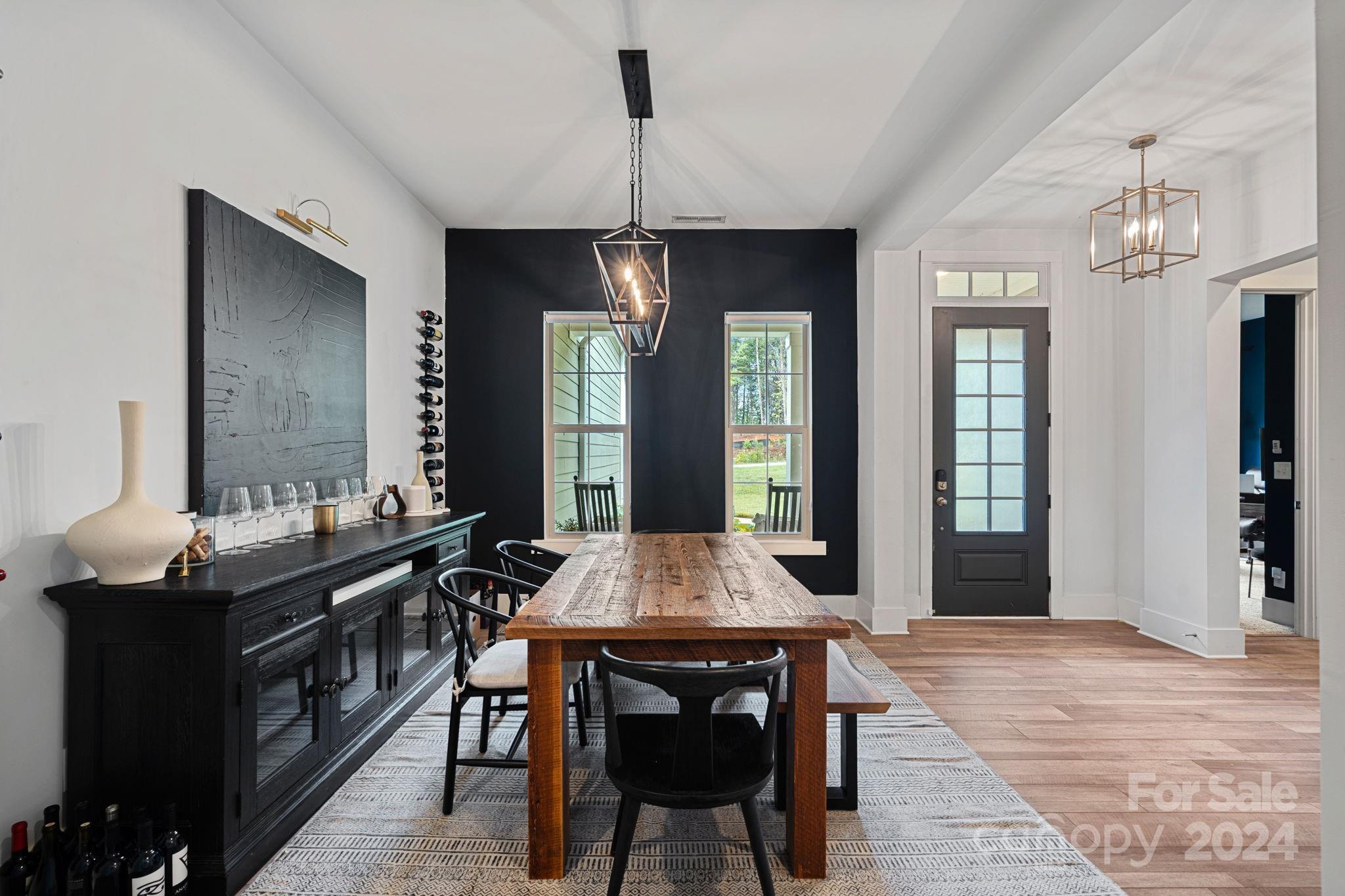 203 Webbed Foot Road Mooresville, NC 28117 - Photo 7 of 34 a view of a dining room with furniture and window