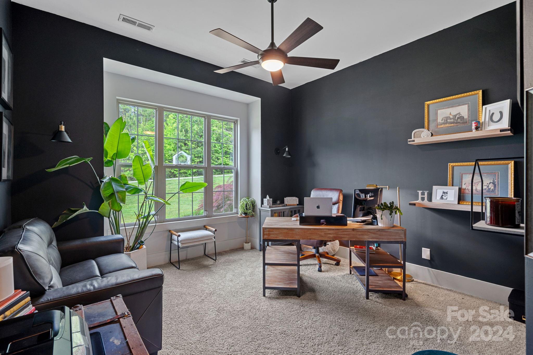 203 Webbed Foot Road Mooresville, NC 28117 - Photo 8 of 34 a living room with furniture and a large window