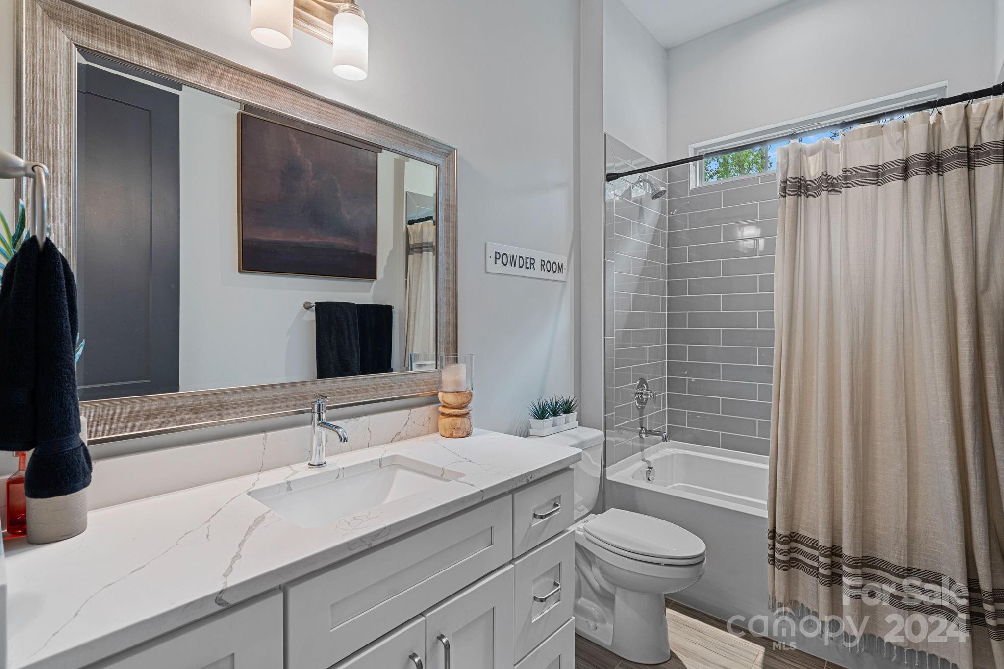 203 Webbed Foot Road Mooresville, NC 28117 - Photo 9 of 34 a bathroom with a sink a toilet and shower