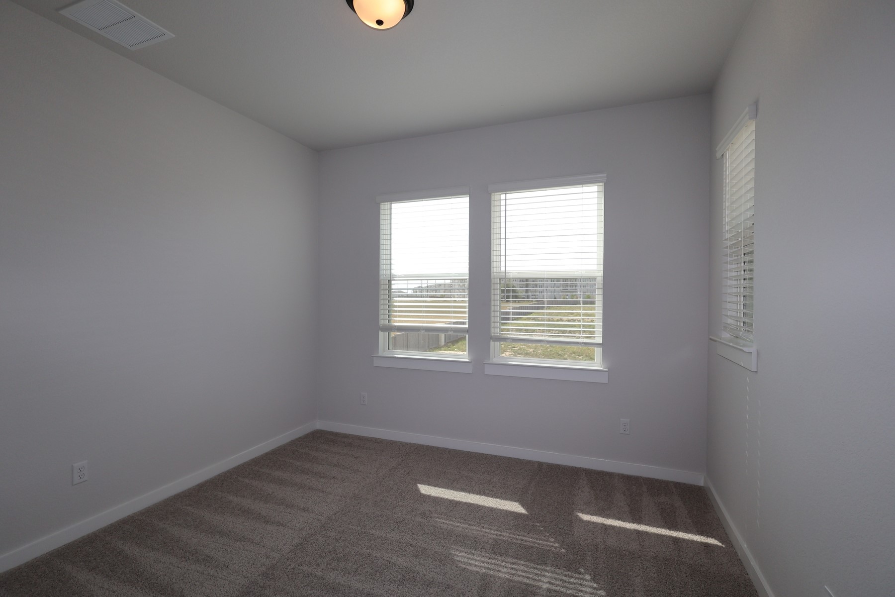 304 Emerie Way Georgetown, TX 78626 - Photo 9 of 15 an empty room with a window