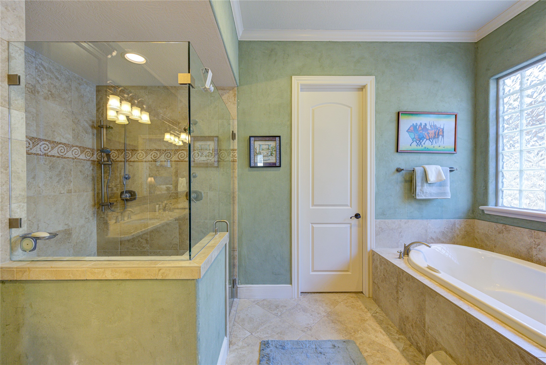 16618 Victoria Falls Lane Spring, TX 77379 - Photo 19 of 49 This spacious, light-filled room offers a perfect blend of relaxation and functionality with its sleek built-in entertainment center and cozy window nook, just steps away from the luxurious master bath.