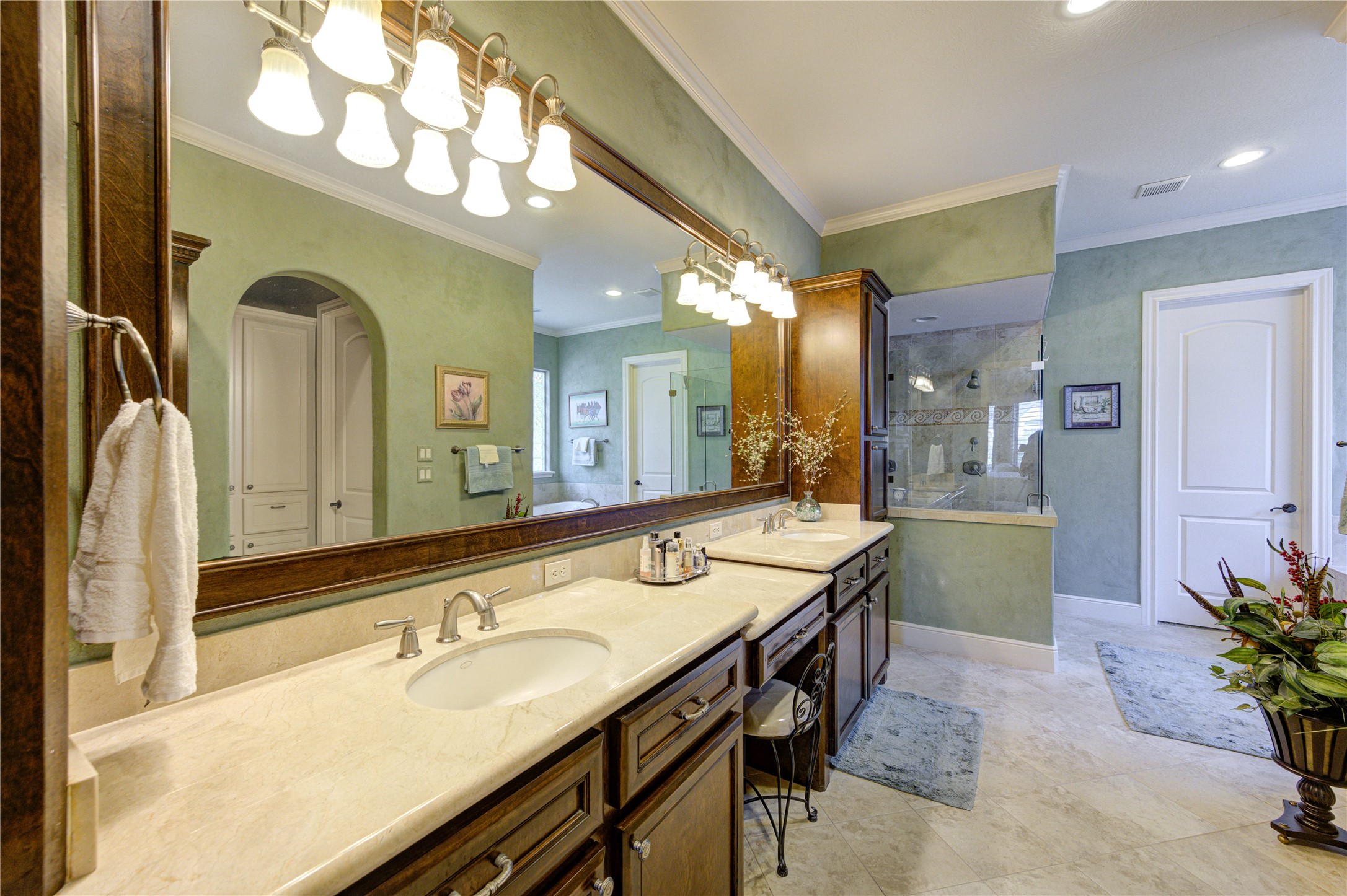 16618 Victoria Falls Lane Spring, TX 77379 - Photo 21 of 49 Discover a master bath oasis with elegant textured walls, a chic vessel sink, and a beautifully tiled shower, perfect for unwinding.