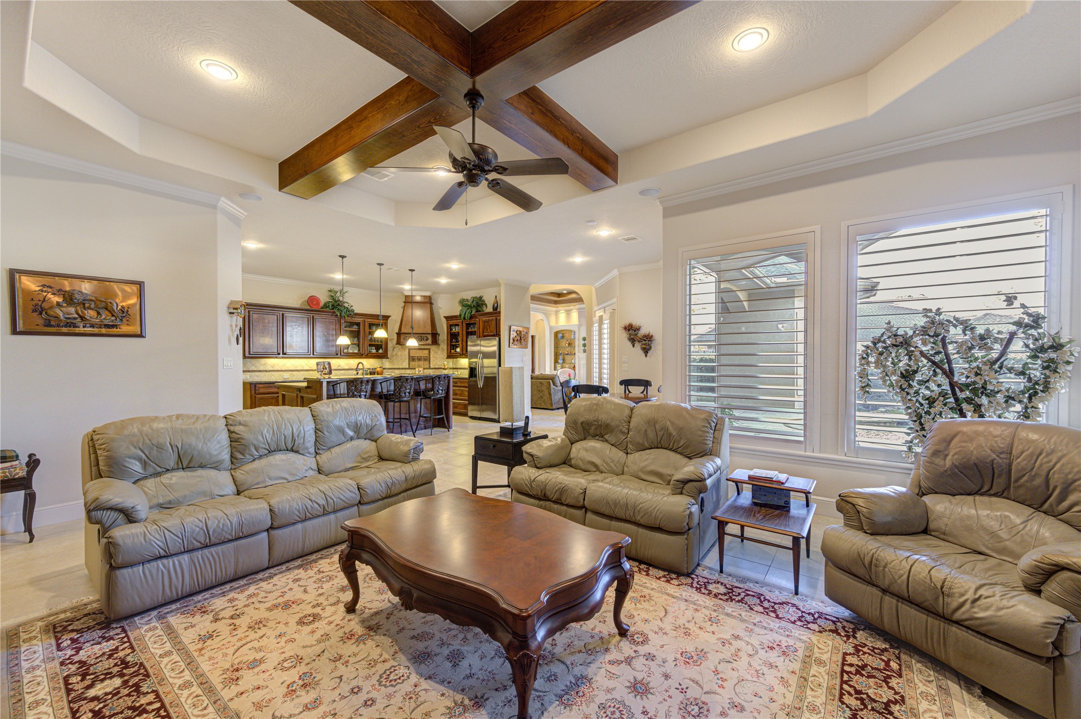 16618 Victoria Falls Lane Spring, TX 77379 - Photo 29 of 49 Inviting family den featuring stunning wood beams, perfect for relaxation and gatherings.