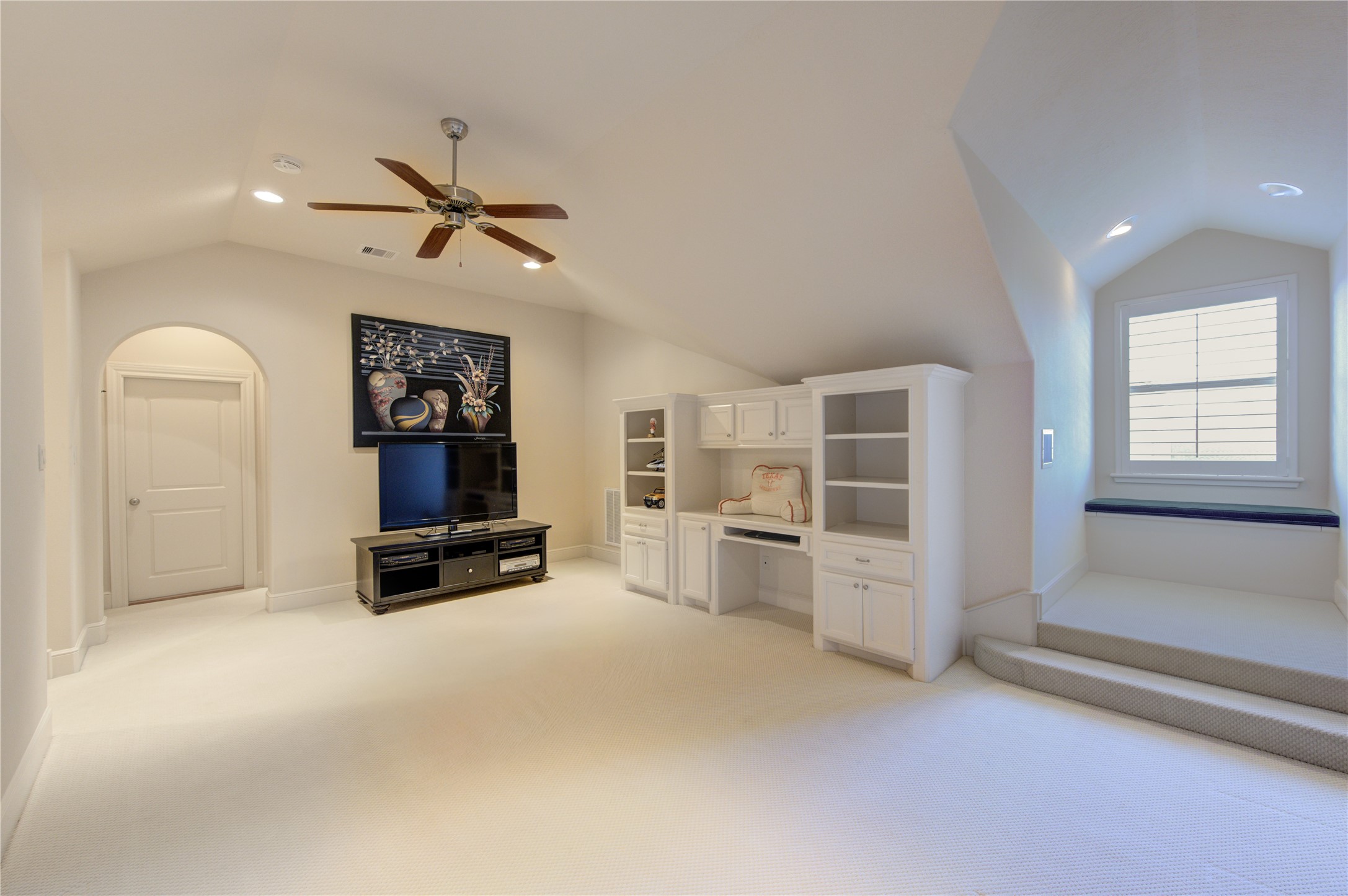 16618 Victoria Falls Lane Spring, TX 77379 - Photo 38 of 49 Versatile space perfect for a game or media room, featuring built-in storage and ample natural light.