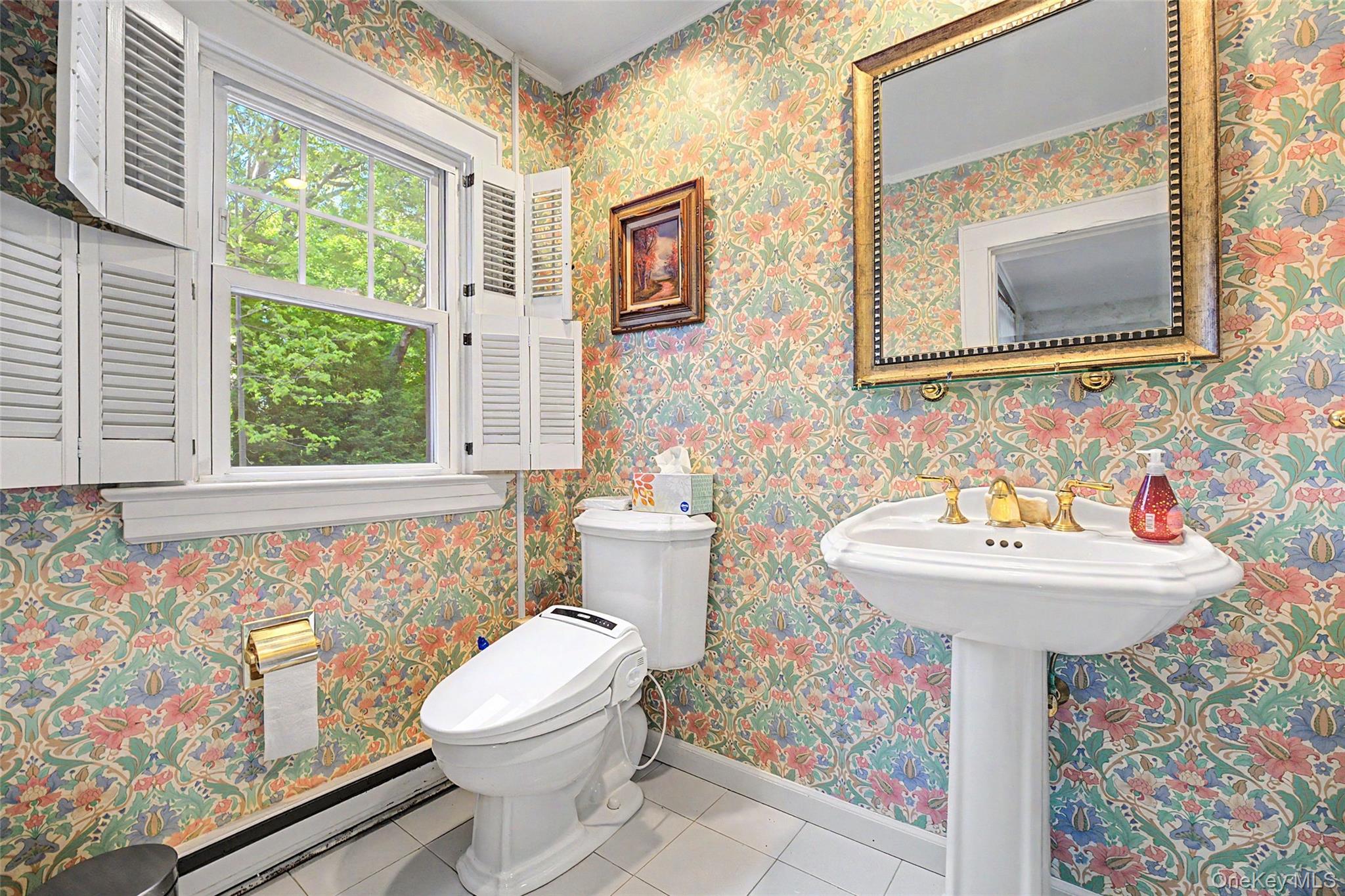 23 Townsend Road Glen Cove, NY 11542 - Photo 11 of 23 a bathroom with a sink a mirror and a toilet