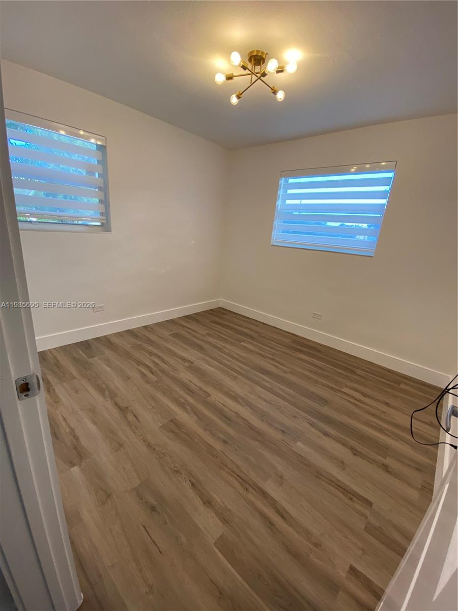6829 Northwest 12th Street, Unit 6829 Plantation, FL 33313 - Photo 15 of 27 a view of an empty room with a window