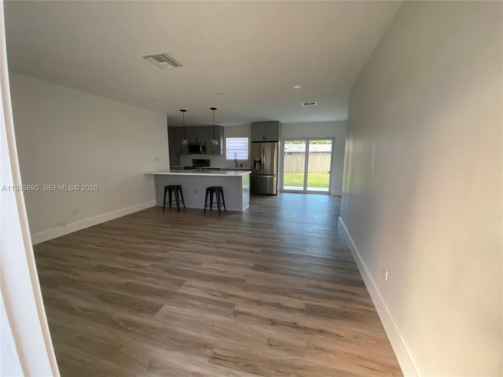 6829 Northwest 12th Street, Unit 6829 Plantation, FL 33313 - Photo 21 of 27 a view of a room with wooden floor