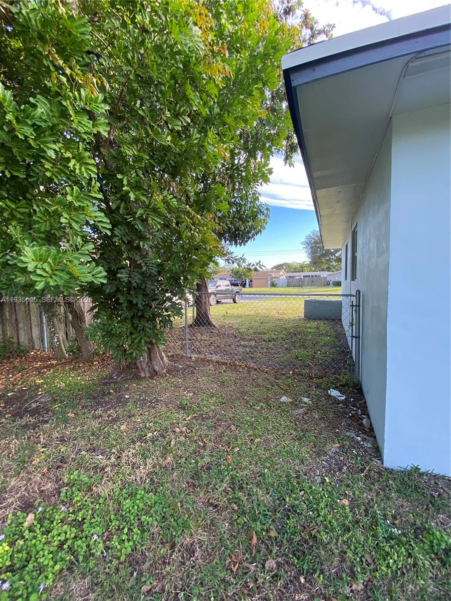 6829 Northwest 12th Street, Unit 6829 Plantation, FL 33313 - Photo 25 of 27 a view of an outdoor space and a yard