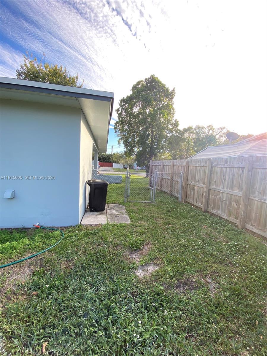 6829 Northwest 12th Street, Unit 6829 Plantation, FL 33313 - Photo 26 of 27 a view of a backyard with potted plants
