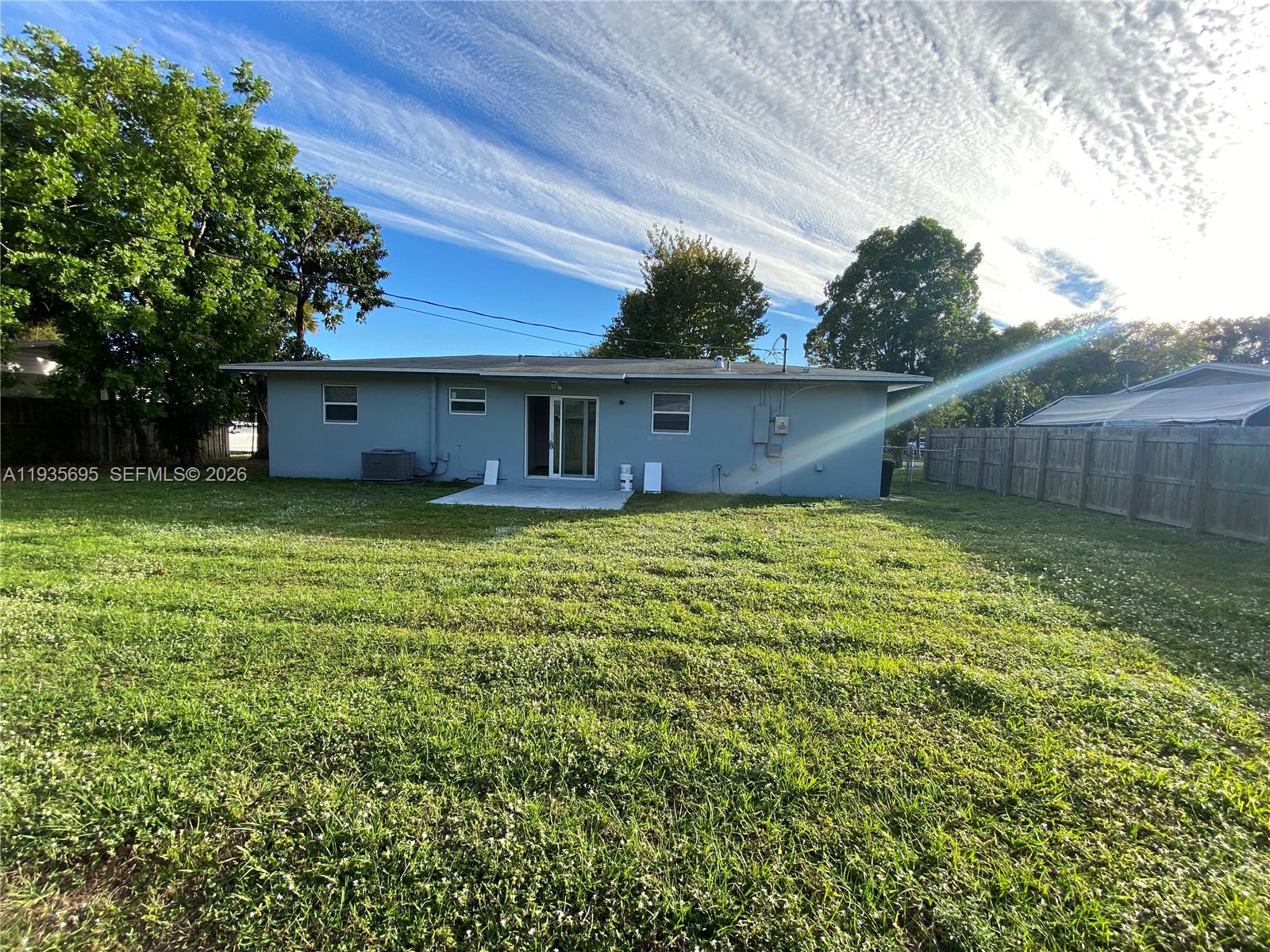 6829 Northwest 12th Street, Unit 6829 Plantation, FL 33313 - Photo 27 of 27 a view of a house with a yard