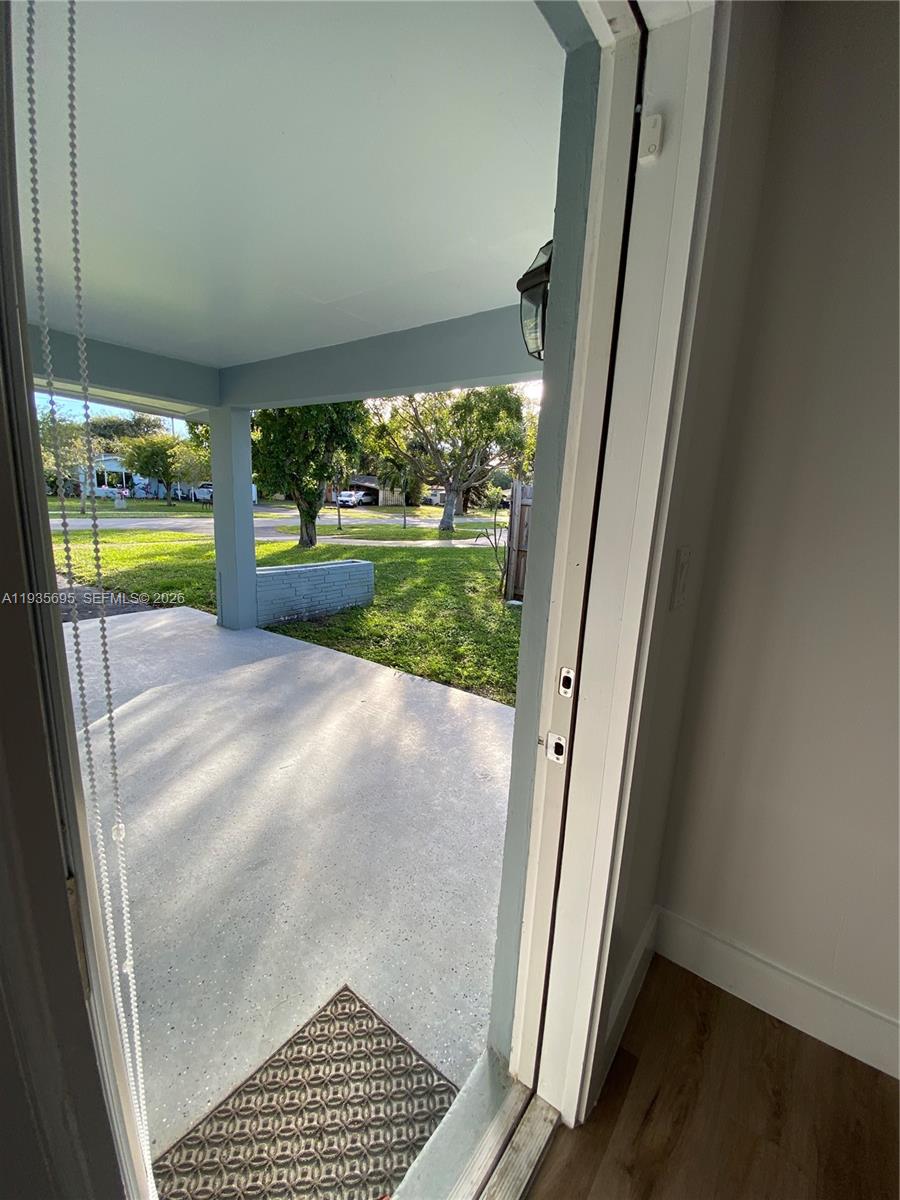 6829 Northwest 12th Street, Unit 6829 Plantation, FL 33313 - Photo 10 of 27 a view of porch with a floor to ceiling window