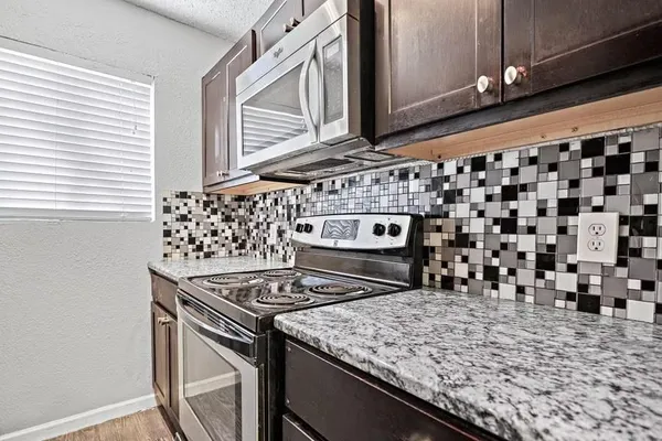 a kitchen with a stove and a sink
