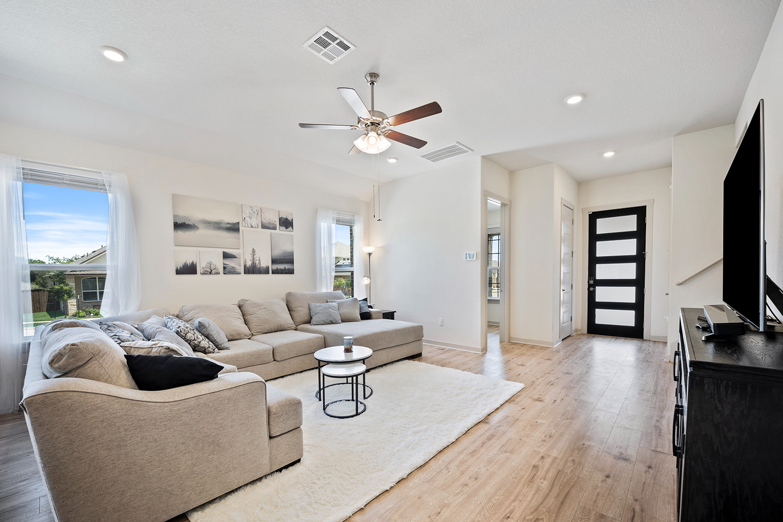 900 Balsora Cove Georgetown, TX 78628 - Photo 4 of 39 Natural light cascades through ample windows, illuminating the spacious living area.
