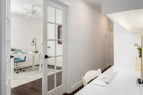 a bed room with a bed and a dresser