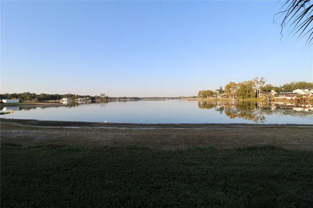 a view of an ocean beach and mountain