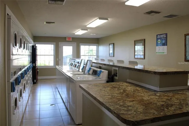 a utility room with washer and dryer