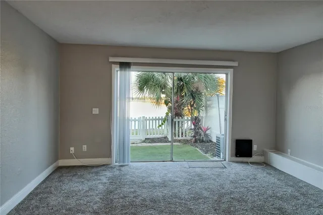 a view of a room with a backyard