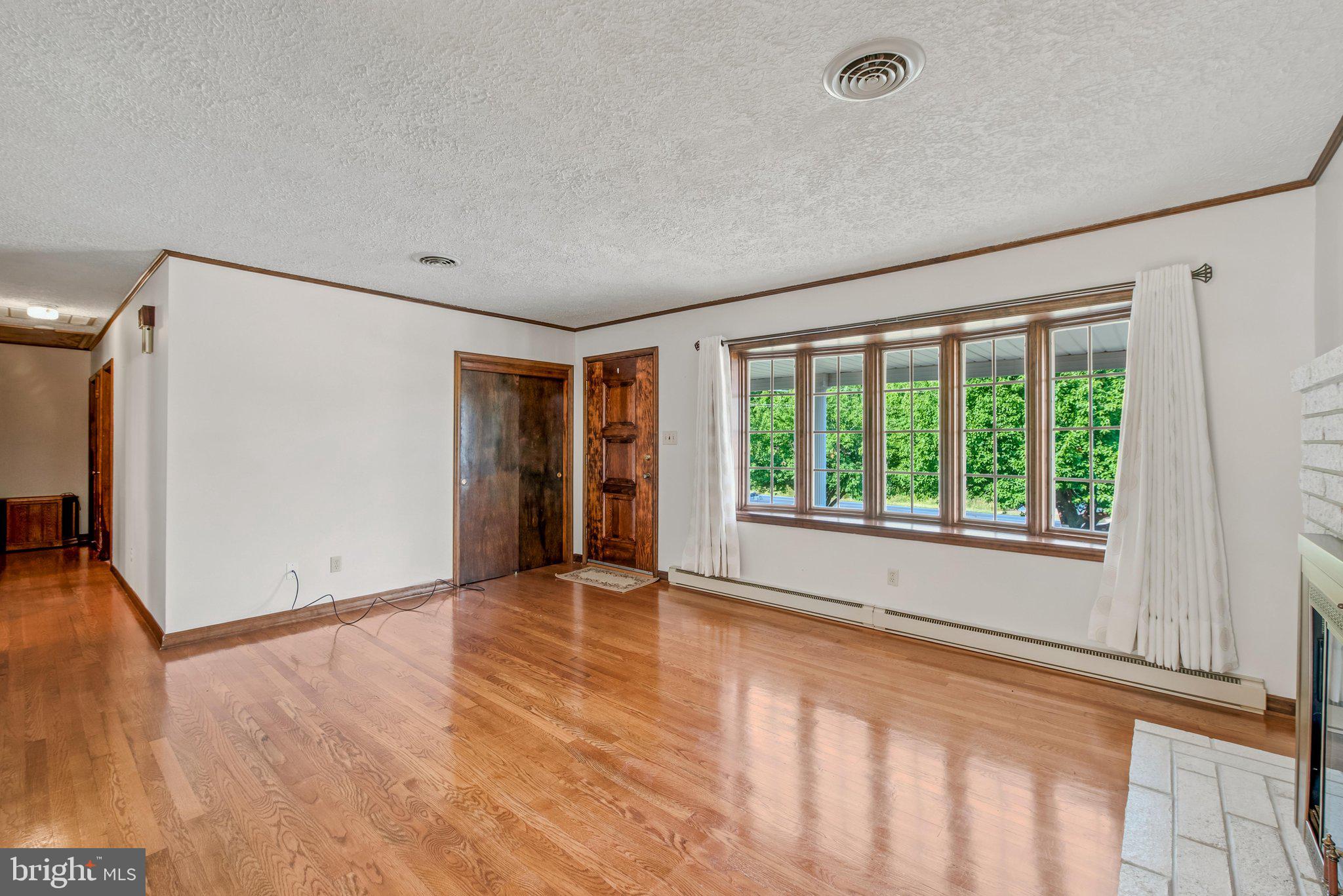 3203 Charles Town Road Kearneysville, WV 25430 - Photo 7 of 45 Bright living room w/ wall of windows, hardwood