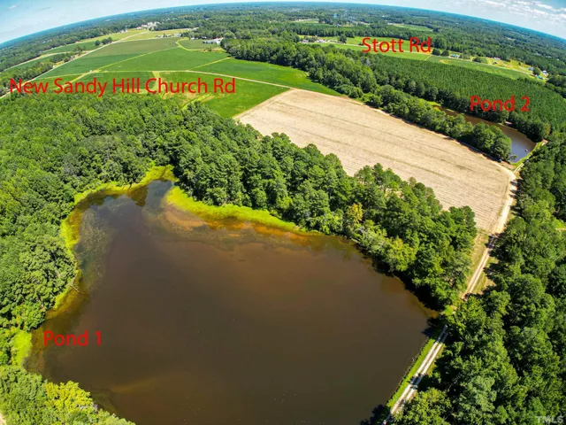 a view of a water pond with green space