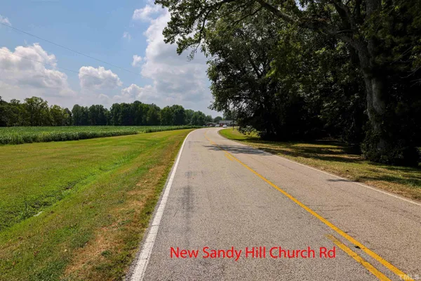 a view of swimming pool with a yard