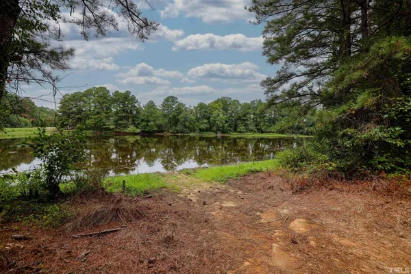 a view of a lake with a yard