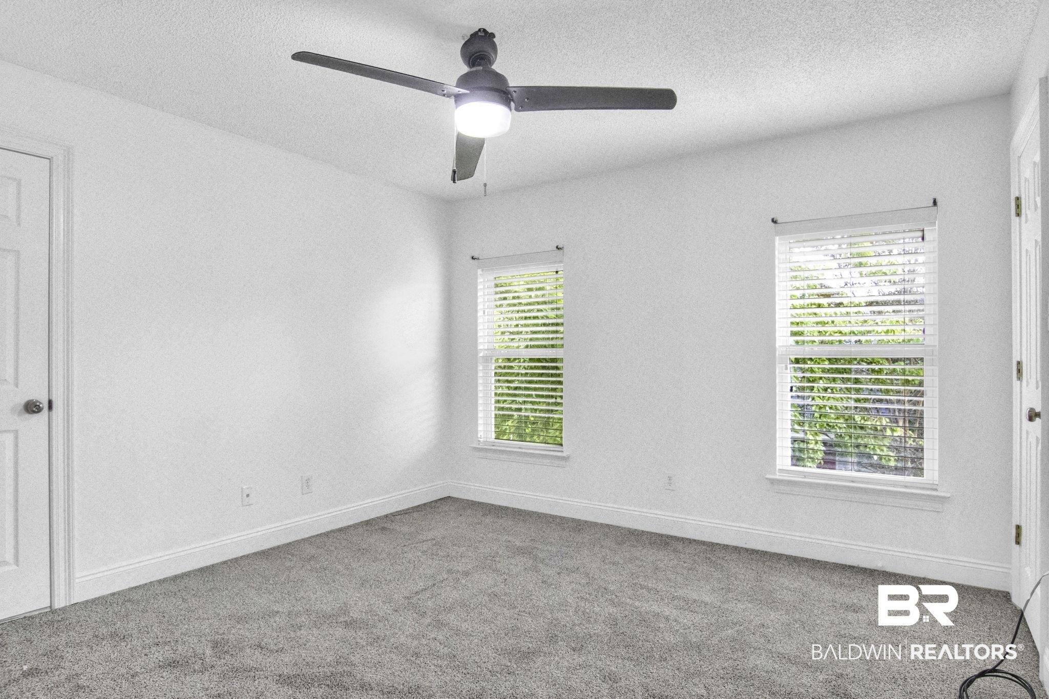 9002 Parliament Circle Daphne, AL 36526 - Photo 47 of 73 Floored attic storage in here, new carpet