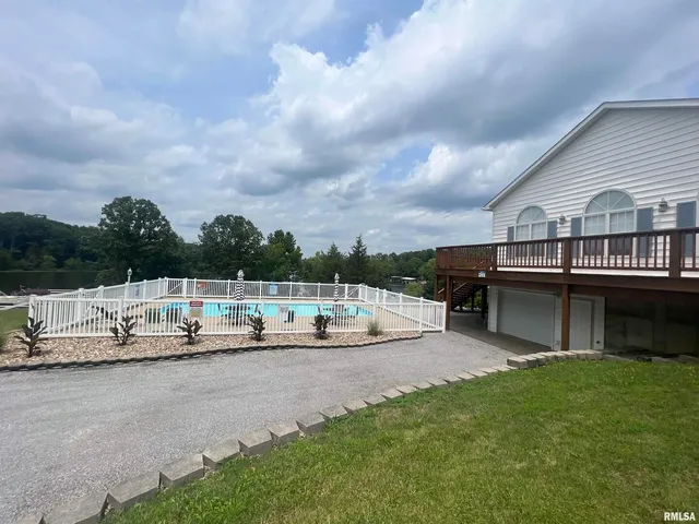 a view of outdoor space with swimming pool and furniture