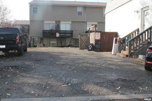 a view of a car park in front of house
