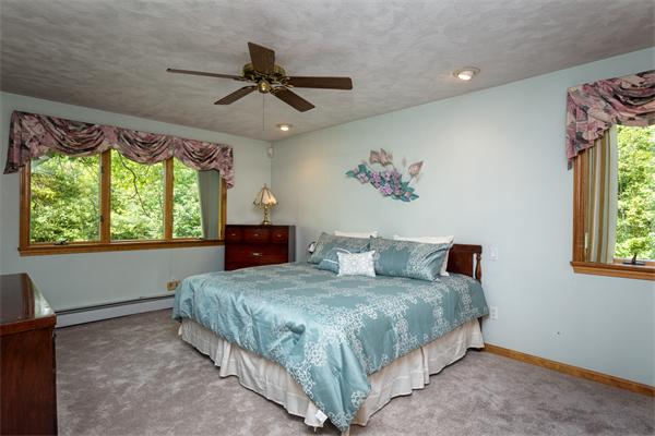 30 Coleman Road Groveland, MA 01834 - Photo 11 of 15 a bedroom with a bed and a painting on the wall